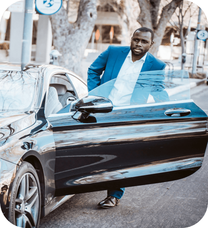 Man stepping out of a luxury car